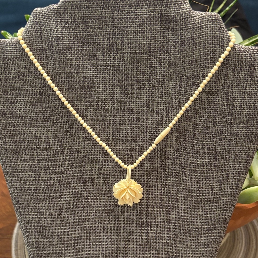 Elegant hand carved bone or ivory,?rose, hand, carved necklace